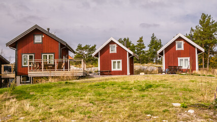 Fototapeta na wymiar Traditional red wooden holiday homes in Sweden Europe