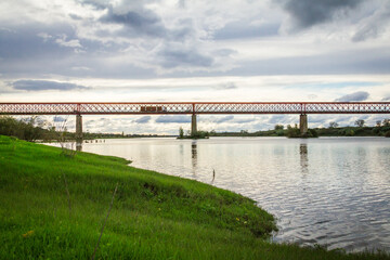 Fototapeta na wymiar Centennial bridge with metal structure over the Tagus River 