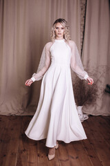 Fototapeta premium Young beauty woman portrait in white dress. Wedding, ellegance, fashion concept