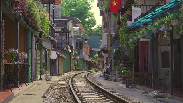 The railway which goes through a residential area in Hanoi city. Hanoi Train Street is a famous tourist destination