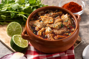 Traditional mondongo or el menudo soup on wooden table
