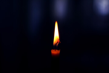 Clouse-up of candle in the dark room