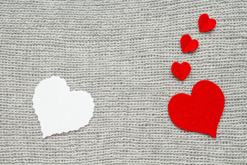Valentine's day. Red heart with white blank note on grey background