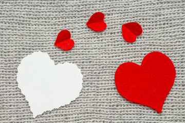 Valentine's day. Red heart with white blank note on grey background