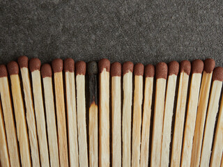 Matchbox with bright colorful matches isolated on a black background