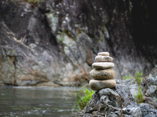 Fototapeta na wymiar Stacked stones and water streams