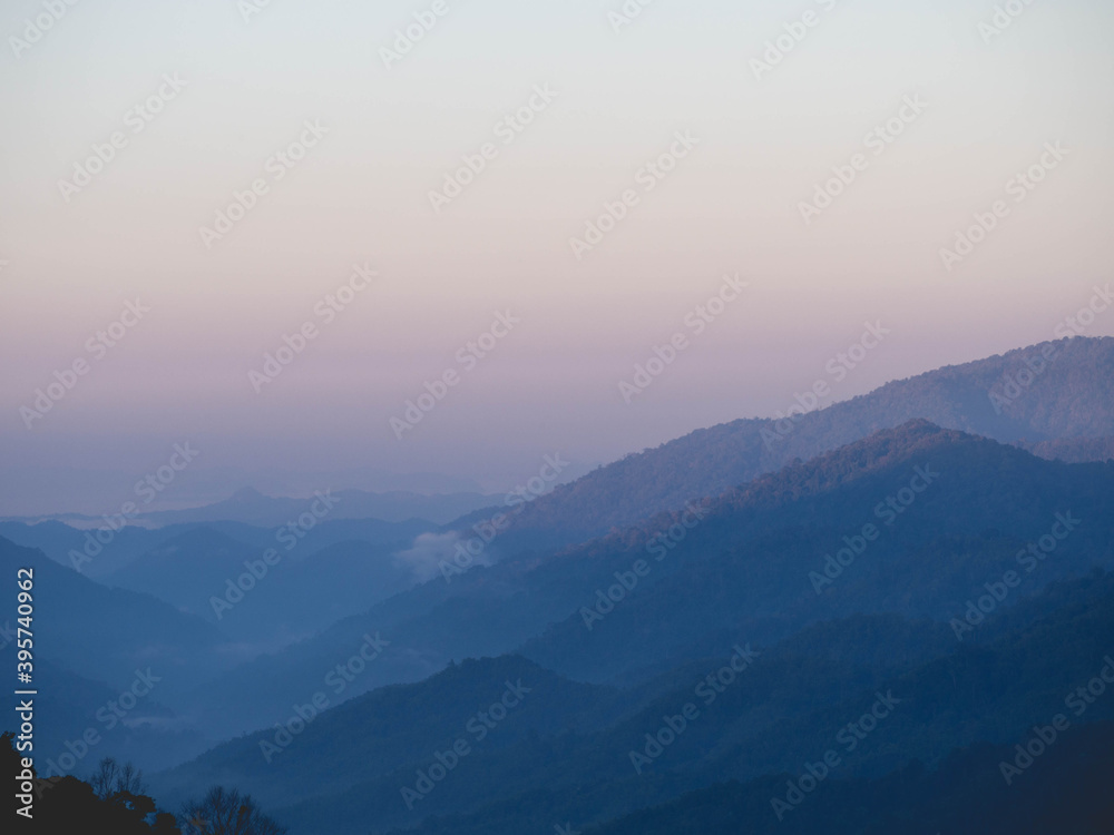 Wall mural misty mountains and morning light