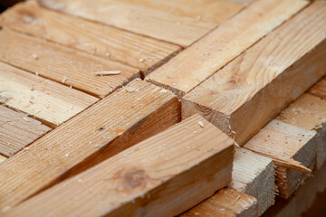 Square wooden planks stacked in rows