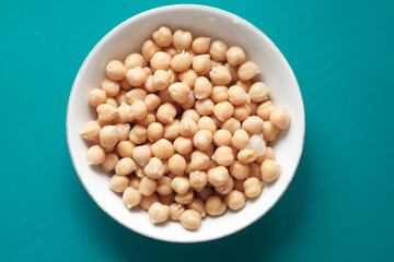 chick peas in a bowl on color background 