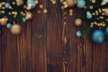 Christmas composition. Christmas balls, blue and silver decorations on blue wooden background. Flat lay. Top view. Copy space