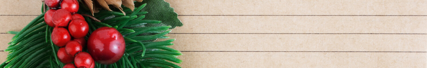 Christmas background. A sheet of ruled notebook or notebook with a Christmas branch. Christmas and New Year concept. Banner. Copy space