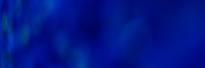 Blue light leaves blurred and blur natural abstract. Effect sunlight  soft bright shiny style  bokeh circle yellow and orange blurry morning . For wallpaper backdrop and background.
