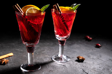 Creative holiday beverage cocktail in geometry drinking glass oh black background