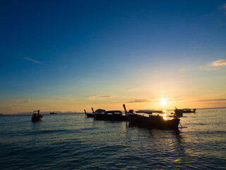 Fototapeta na wymiar Boat on sea beach colorful sky sunset nature vacation landscape