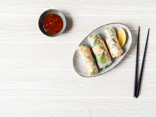 Vietnamese spring rolls and spicy sauce bowl