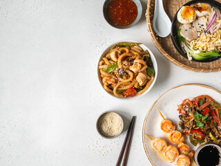 Obraz na płótnie Canvas Set asian food - ramen soup, grilled shrimp, stir fry vegetables and udon with seafood