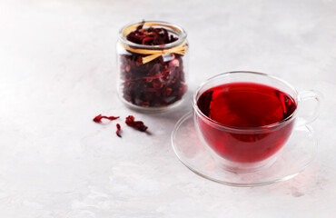 Healthy hibiscus tea in transparent cup