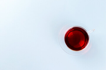 Healthy hibiscus tea in transparent cup