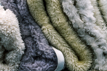 Wool fabric. A soft and warm blanket. Material for the production of clothing. Cloth samples close up. Textile background.