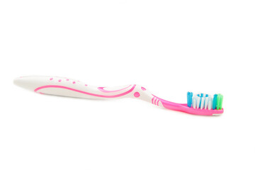Pink toothbrush isolated on a white background