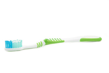 Green toothbrush isolated on a white background