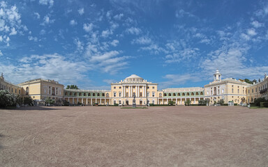 Fototapeta na wymiar Pavlovsk, Saint Petersburg, Russia. Panoramic view of Pavlovsk Palace, the 18th-century Russian Imperial residence built for Emperor Paul I of Russia, whose statue stands in the courtyard.