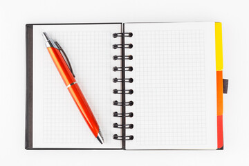 Spiral Notebook with pen on a gray background. Flat lay. Copy space.