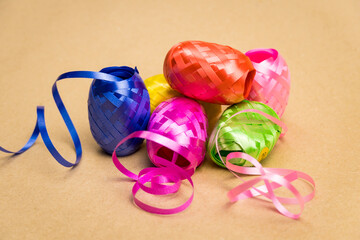 Multicolored decorative ribbons stacked in a pile