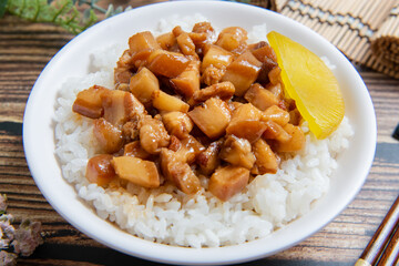 braised pork on rice is Minced pork served with pickles on top of steamed rice