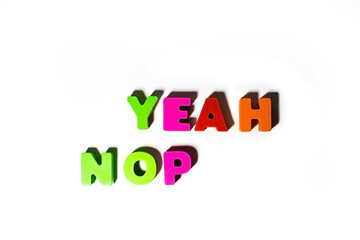 Colorful wooden letters with Yeah and Nope text at isolated background with shadows