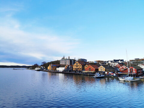 Houses and parked boats by the sea captured in Tonsberg, Norway