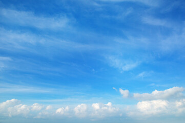 Naklejka na ściany i meble A clear blue sky with white clouds