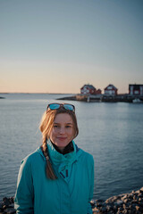 Fototapeta premium Young woman smiling during a trip around Nord Trondelag in April