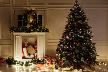 Fototapeta na wymiar Christmas tree garland lights with New Year's Eve gifts