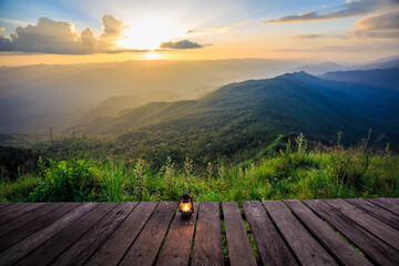 Wooden walkway with lanterns and sunrise in the morning
