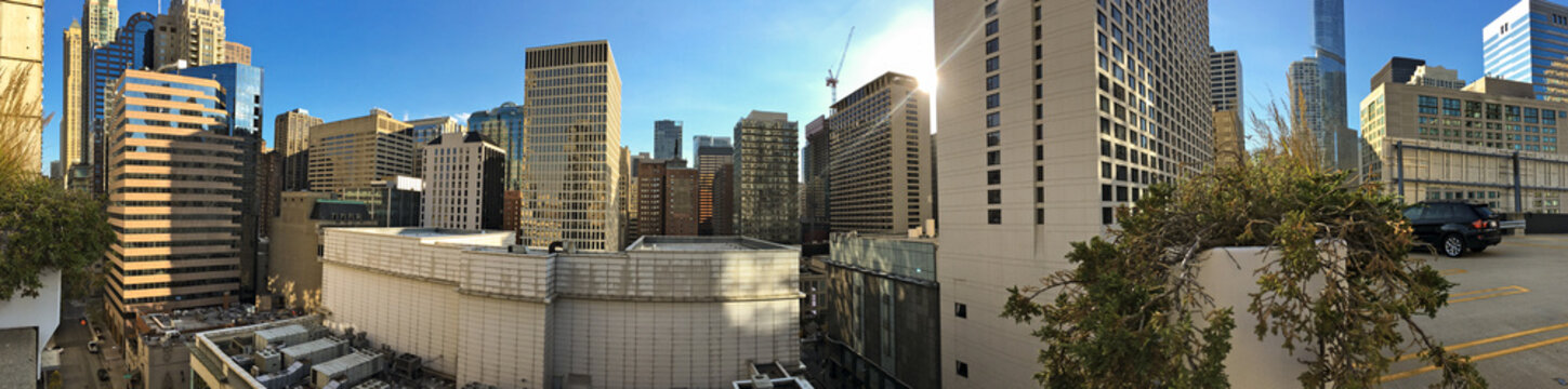 Panoramic Skyline View Of Downtown Chicago In Illinois With Modern Architecture Skyscrapers And Highrises For A Breathtaking Silhouette Against Blue Sky From Parking Lot