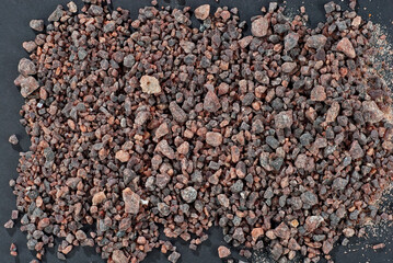 Black Tibetan salt close up. Texture of brown and black salt crystals.