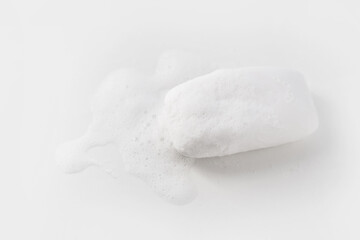Soap with foam on a white background Soap used in everyday life, including washing, bathing