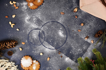 Christmas, new year. Blue background, decor, craft fabric, threads, nuts, spruce. Empty place under the text, powdered sugar