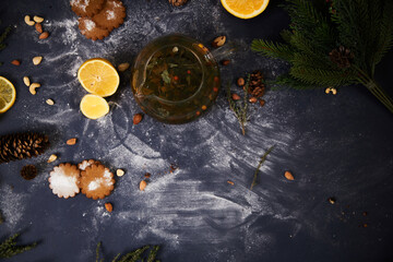 Glass teapot with lemons, Christmas decor with spruce