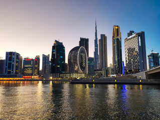 Obraz na płótnie Canvas Downtown Dubai modern cityscape skyline view from the Marasi marina in the Business Bay at sunset in the United Arab Emirates