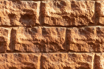 Brown brick wall. Brown brick texture. Uneven brickwork