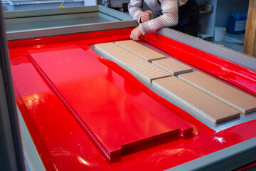 pasting mdf panels on a vacuum machine with vinyl film for further furniture production