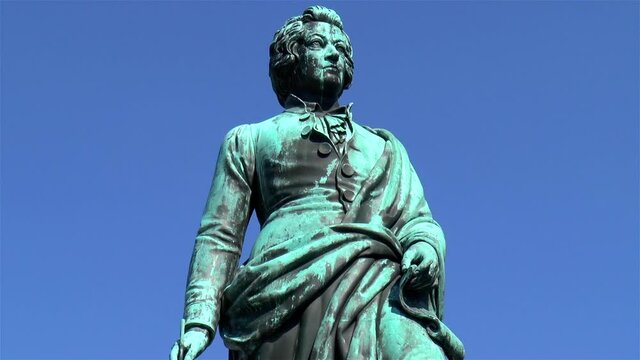 Close-up view of the Mozart statue at Mozart Square, in Salzburg, Austria.