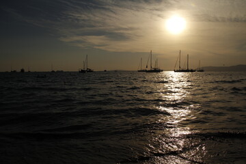 Sunset at the sea in Palmda de Mallorca with sailboats