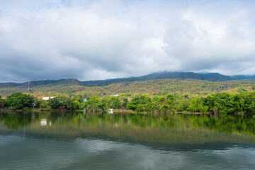 Fototapeta premium landscape lake views at Ang Kaew Chiang Mai University in nature forest Mountain views spring blue sky background with white cloud.