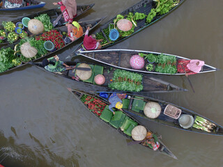 
Banjarmasin Indonesia November 27, 2020 : Famous floating market in Indonesia, Lok Baintan floating market, tourists visiting by boat. Aerial Traditional Floating Market in Indonesia