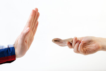 A woman's hand gives a bribe to a refusing man's hand in a shirt the color of the Russian flag....