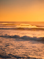 Perfect waves at sunset or sunrise. Big waves for surfing in Bali