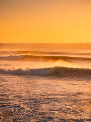 Perfect waves at sunset or sunrise. Big waves for surfing in Bali